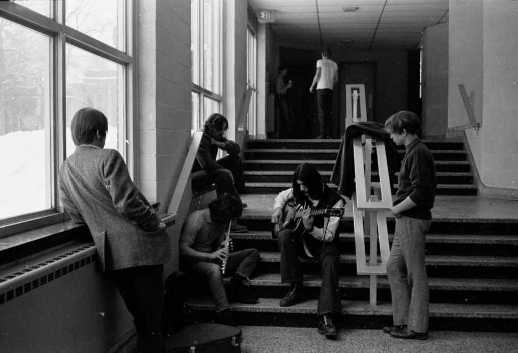 Guitar Rob (REL) LaVechhio and Flute in hallway near auditorium, Closer shot