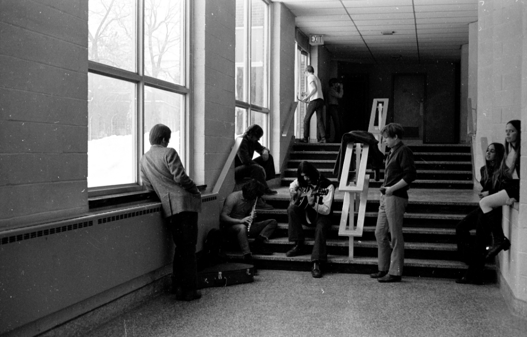 Guitar Rob (REL) LaVechhio and Flute in hallway near auditorium