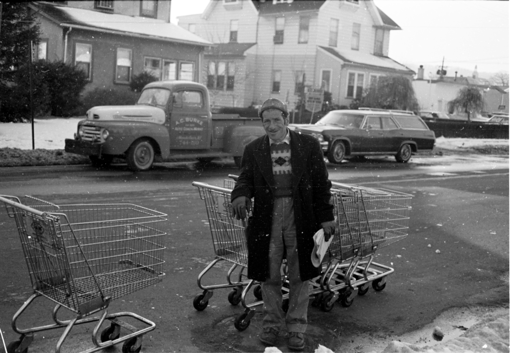 Tony "Spolly" collecting carts on Walnut Street.