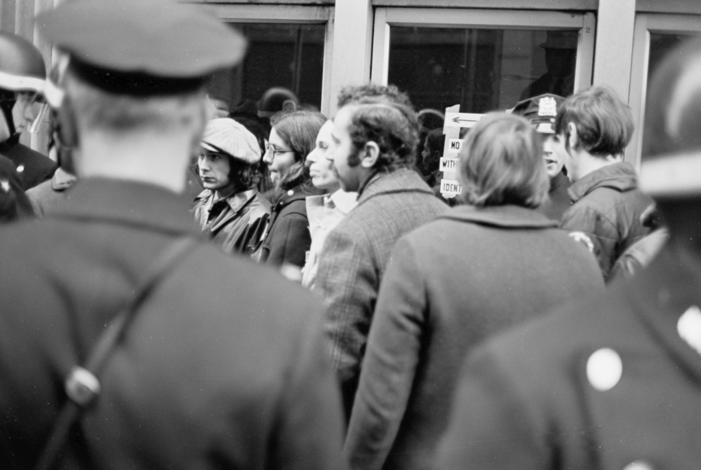 Some demonstrators on the draft board side of the police line