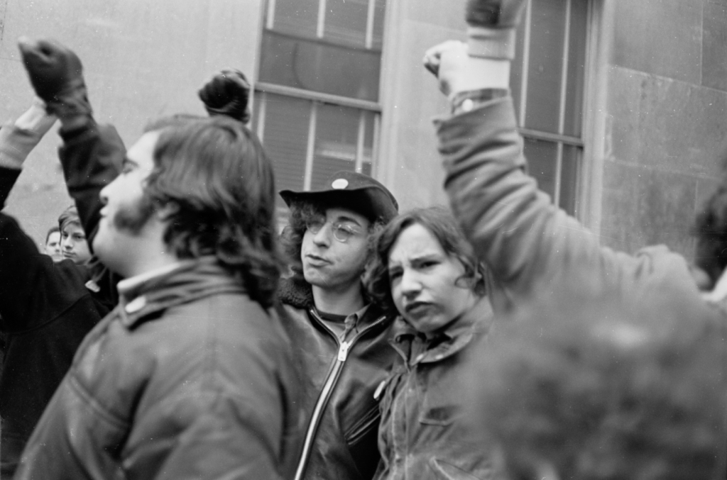 Demonstrators giving power sign